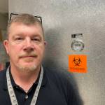 Michael S. Lockett / The Daily World
Grays Harbor County Coroner George Kelley recently started in the position. He stands in front of the offices fridge on Feb. 8.