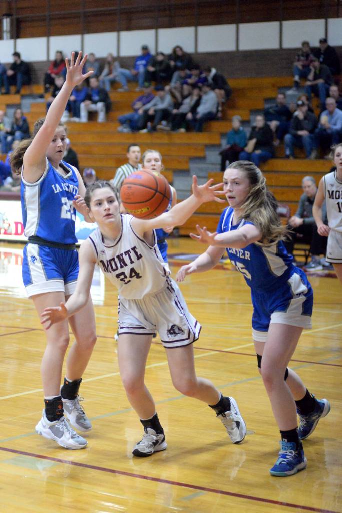 RYAN SPARKS | THE DAILY WORLD Montesanos Jillie Dalan (24) and La Centers Talia Wise, right, pursue a loose ball during the Bulldogs 67-5 victory in the first round of the 1A District 4 Tournament on Thursday in Montesano.