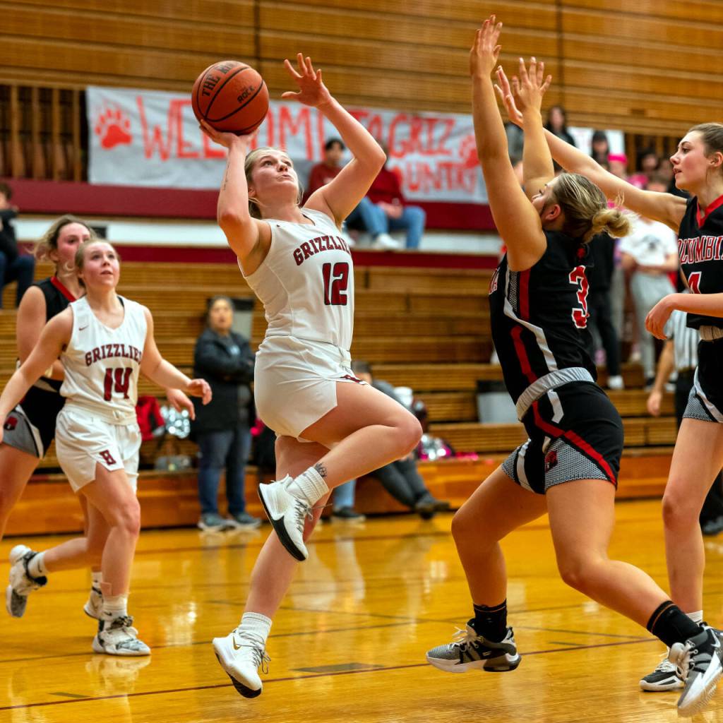 PHOTO BY FOREST WORGUM Hoquiams Ashlinn Cady (12) puts up a shot during the Grizzlies 57-44 win in the first round of the 1A District 4 Tournament on Thursday in Hoquiam.