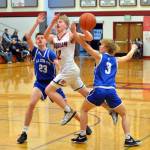 RYAN SPARKS | THE DAILY WORLD Hoquiam guard Michael Lorton Watkins passes the ball while defended by La Centers Logan Rainey (23) and Garrett Maunu during the Grizzlies 86-57 victory in the 1A District 4 Tournament on Friday in Hoquiam.