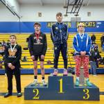 SUBMITTED PHOTO Aberdeens Mikey Hatton (1) stands atop the podium after winning the 126-pound championship at the 2A Region 3 Championships on Saturday in Aberdeen.