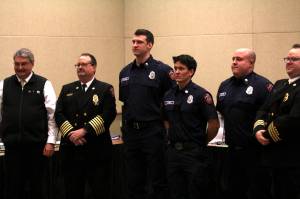 Michael S. Lockett / The Daily World 
New joins to the Ocean Shores Fire Department stand alongside officers of the department and Ocean Shores Mayor Jon Martin, left, during a swearing-in ceremony on Feb. 13.