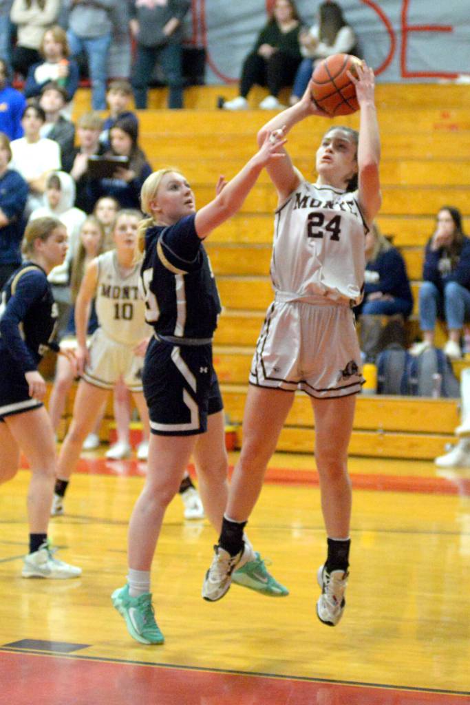 RYAN SPARKS | THE DAILY WORLD Montesano forward Jillie Dalan (24) puts up a shot against Seton Catholics Alyssa Mancuso during the Bulldogs 72-36 victory in the 1A District 4 Championship on Friday at Castle Rock High School.