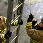Michael S. Lockett / The Daily World
Volunteer firefighters practice ladder techniques during a firefighter academy in Westport on Feb. 18.