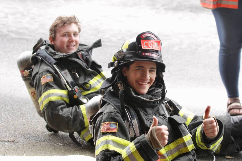 Volunteer firefighters Kody LaLonde and, left, and Parker Gleason of the Montesano Fire Department take a break between breaching exercises during a firefighter academy in Westport on Feb. 18. (Michael S. Lockett / The Daily World)