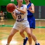 PHOTO BY FOREST WORGUM Willapa Valley freshman Lauren Matlock (12) looks to pass during the Vikings 51-30 victory over Orcas Island in a 1B State playoff game on Saturday in Tumwater.