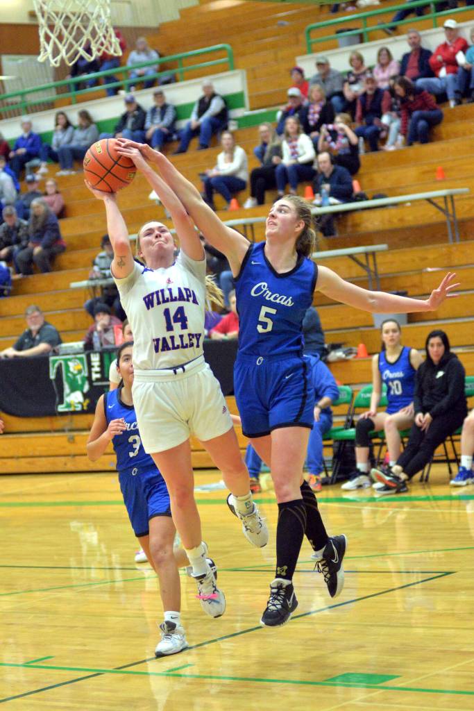 RYAN SPARKS | THE DAILY WORLD Willapa Valley senior Grace Huber (14) is fouled by Orcas Islands Bethany Carter during the Vikings 51-30 win in a 1B State first-round game on Saturday in Tumwater.