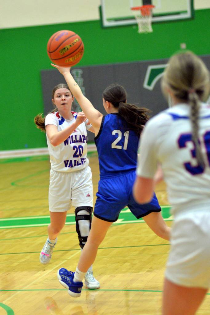 RYAN SPARKS | THE DAILY WORLD Willapa Valley point guard Brooklyn Patrick (20) sends a pass ahead to Hadlee Russell during the Vikings 51-30 win over Orcas Island in a 1B State first-round game on Saturday in Tumwater.