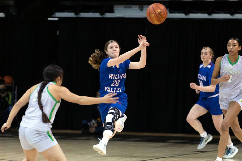 ALEC DIETZ | THE CHRONICLE Willapa Valley guard Brooklyn Patrick rockets a pass mid-air to a teammate against Inchelium in the 1B State Tournament Round of 12 at the Spokane Arena on Wednesday.