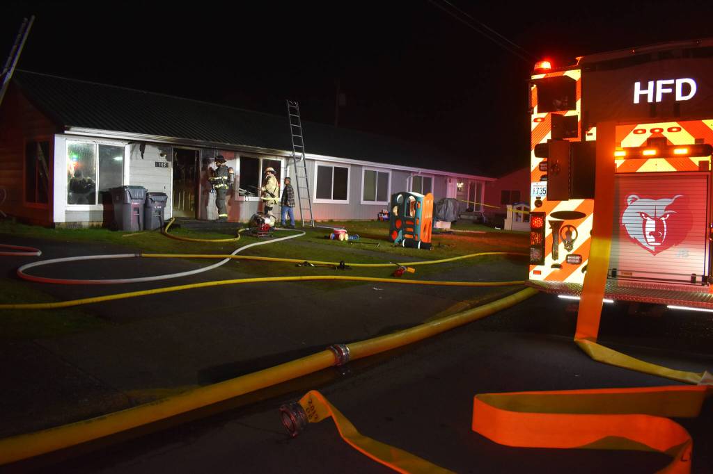 Hoquiam and Aberdeen firefighters as well as the Hoquiam Police Department responded to a structure fire at a Hoquiam residence on Saturday night, Feb. 11. (Matthew N. Wells / The Daily World)