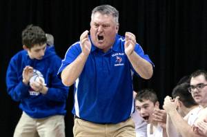 ALEC DIETZ | THE CHRONICLE
Willapa Valley coach Jay Pearson claps after a big play against Mossyrock in the 2B state quarterfinals on Thursday at the Spokane Arena.