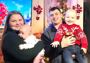 Courtesy photo 
From left, Heidi Hamilton holds her baby, Archer, as her husband Anthony holds Sterling. The family is in good spirits more than a year after Sterling  then at 14 months old  survived heart surgery.