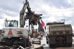 Clayton Franke / The Daily World 
The Aberdeen Public Works Department worked for much of the day Friday, March 10, to clear makeshift structures, debris and trash from the homeless camp on East River Street.