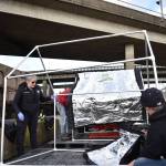Clayton Franke / The Daily World 
Laina Caldwell, behavioral health navigator for the three central Grays Harbor police departments, helps residents of the East River Street encampment set up new city-provided tents after the city tore down existing structures there.