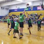 Allen Leister / The Daily World
#10 David Quigg, the owner of Quigg & Co Real Estate, attempts a mid-range jumper over #40 Karter Zillyette of the Grays Harbor Hawks White Hawks lineup in the first game of the 11th annual Celebrity Basketball Game & Fundraiser.