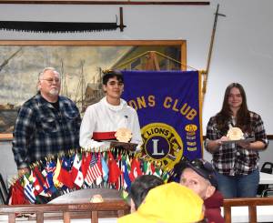 Gerald Schaefer, left, stands with Alejandro Atwell and Carron Blood on Tuesday. The pair of senior Hoquiam High School students received Student of the Month awards from Hoquiam Lions Club in front of at least 100 attendees who were inside the Hoquiam Elks Lodge. Both students have at least an eye on attending Grays Harbor College in the future.
Matthew N. Wells
 / The Daily World