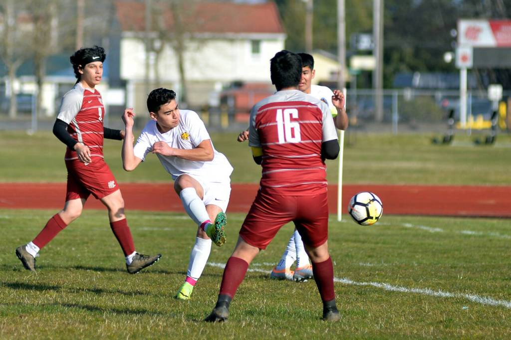 Photos by RYAN SPARKS / THE DAILY WORLD 
Aberdeen senior midfielder Carlos Mendoza, center, connects on a cross for a goal in the first half of the Bobcats 10-0 win over Hoquiam on Wednesday at Sea Breeze Oval in Hoquiam.
