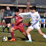 RYAN SPARKS | THE DAILY WORLD 
Hoquiam's Kunanon Chaiyakam (14) and Aberdeen's Giovanni Ambrogiani compete for possession during the Bobcats' 10-0 win on Wednesday at Sea Breeze Oval in Hoquiam.
