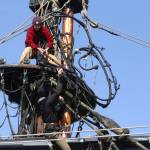 Michael S. Lockett / The Daily World
The crew of the Lady Washington hoist parts of the topmasts aloft as they prepare the ship for sea.