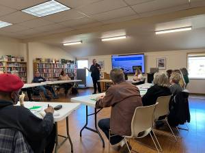 Clayton Franke / The Daily World
Ocean Shores Mayor Jon Martin (standing) addresses a group of 18 residents at the inaugural Citizens Academy on Friday, March 17 at the Ocean Shores Library.