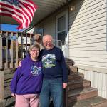 Caroline (left) and Bill Hardy pose outside their mobile home in South Aberdeen. (Clayton Franke / The Daily World)