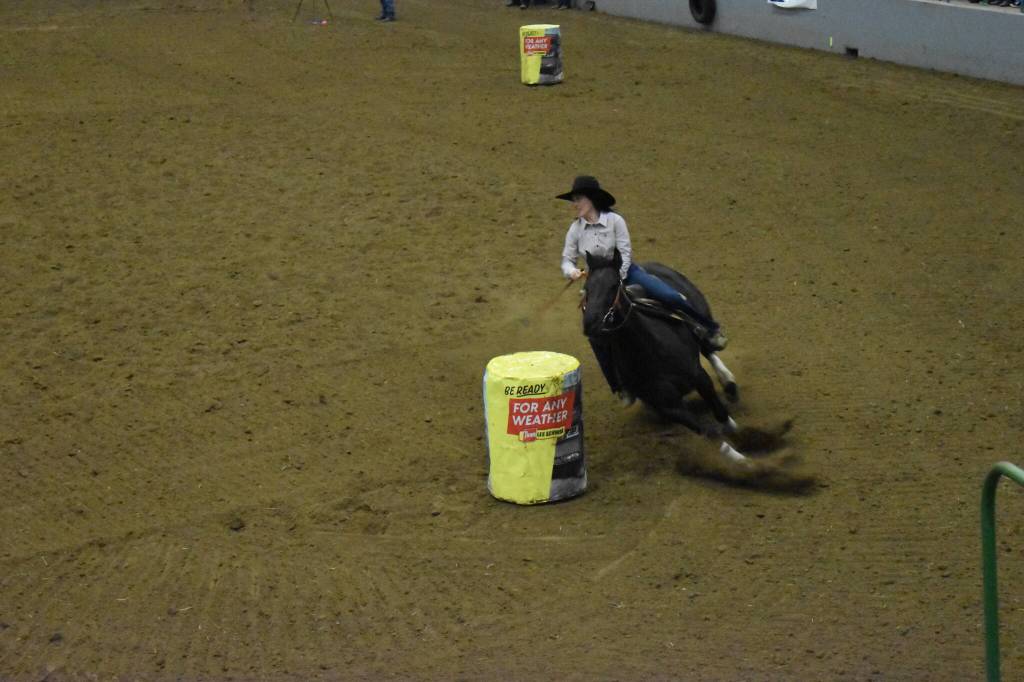 In a race for the fastest time, multiple cowgirls competed in the barrel racing event of the 27th annual Grays Harbor Indoor Pro Rodeo. While most completed times were neck and neck the fastest barrel race horse clocked in at 13.86 seconds. (Coutesy photo / Madison Radonski)