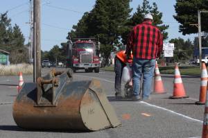 Clayton Franke / The Daily World
Crews from Rognlins Inc. cut pavement Monday, March 27 on a crosswalk that will traverse Point Brown Avenue in Ocean Shores. Construction will end May 11 and resume for three days in early July, city officials said.