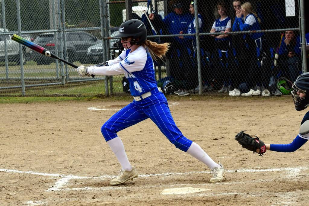 PHOTO BY CHRYSTAL WELD Elmas Chloe Donais puts the ball in play during the Eagles 15-2 victory over Eatonville on Wednesday in Elma.