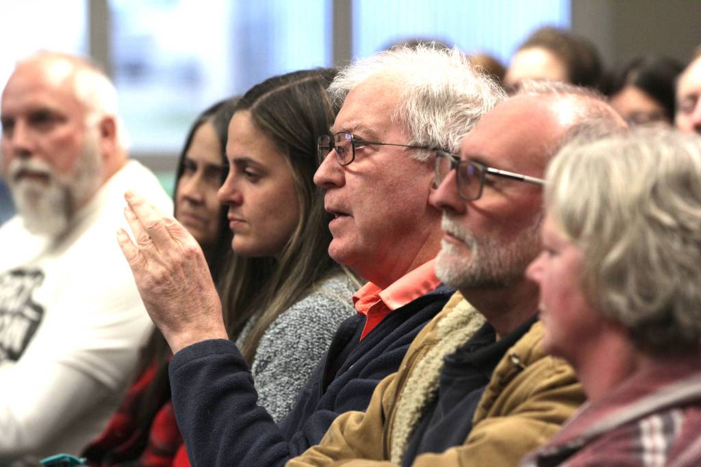 A member of the crowd asks a question to leadership of the local fire departments during a meeting about the proposed creation of a regional fire authority for Central Grays Harbor on March 28. (Michael S. Lockett / The Daily World)