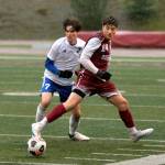 RYAN SPARKS | THE DAILY WORLD Montesano forward Felix Romero (14) shields the ball from Elma midfielder Hank Doelman during the Bulldogs 2-1 win on Friday in Jack Rottle Field in Montesano.