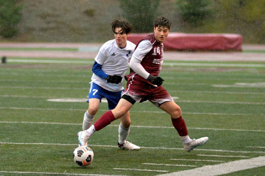 RYAN SPARKS | THE DAILY WORLD Montesano forward Felix Romero (14) shields the ball from Elma midfielder Hank Doelman during the Bulldogs 2-1 win on Friday in Jack Rottle Field in Montesano.