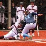 PHOTO BY FOREST WORGUM Montesanos Jordan Karr, left, slides in to home in the Bulldogs 15-9 victory over Lynden Christian on Saturday at Montesano High School.
