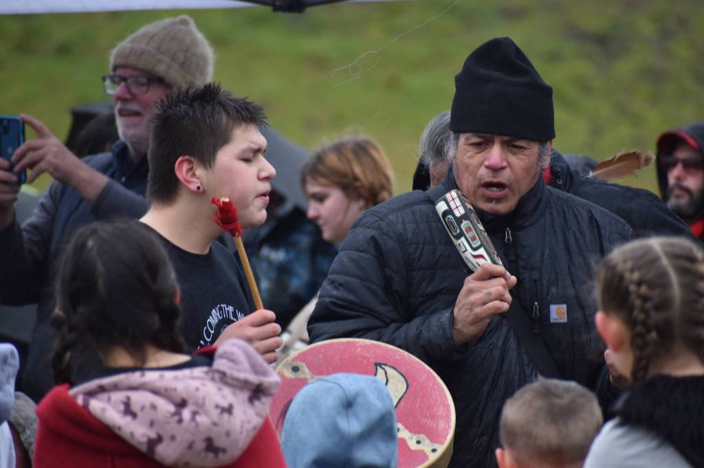 David Ward, left and Marco Black lead the Welcoming the Whales ceremony at First Beach.