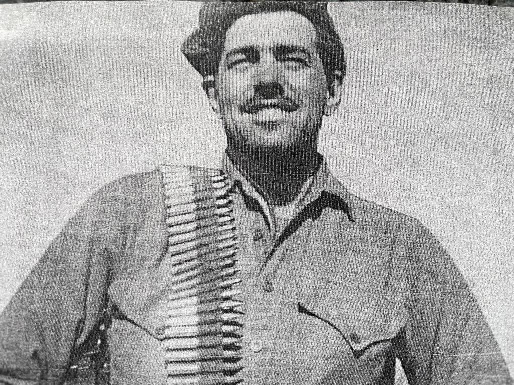 Courtesy photo / Jim Evans
Jim Evans, a Marine veteran of Korea and one of the Chosin Few, carries a belt of uncased machine gun ammunition over his shoulder during the war.