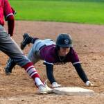 PHOTO BY FOREST WORGUM Montesanos Christian Olsen dives back to first base during the Bulldogs doubleheader sweep over Hoquiam on Tuesday at Vessey Field in Montesano.