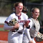 DAILY WORLD FILE PHOTO Montesano first baseman Kylee Wisdom, left, hit a home run and drove in five runs in a 19-2 win over Eatonville on Thursday in Eatonville. Wisdom is joined by Alisyn Parkin in the photo.