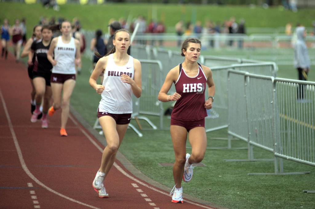 RYAN SPARKS | THE DAILY WORLD Hoquiams Jane Roloff, right, and Montesanos Samantha Schweppe race in the girls 3,200 meter race at the Ray Ryan Memorial Grays Harbor All-County Meet on Friday in Montesano.