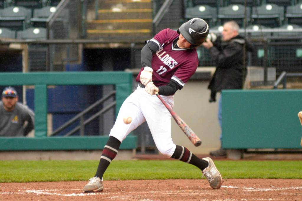 RYAN SPARKS | THE DAILY WORLD Montesanos John Kling smacks a base hit during a 6-5 win over Aberdeen on Saturday at Cheney Field in Tacoma.