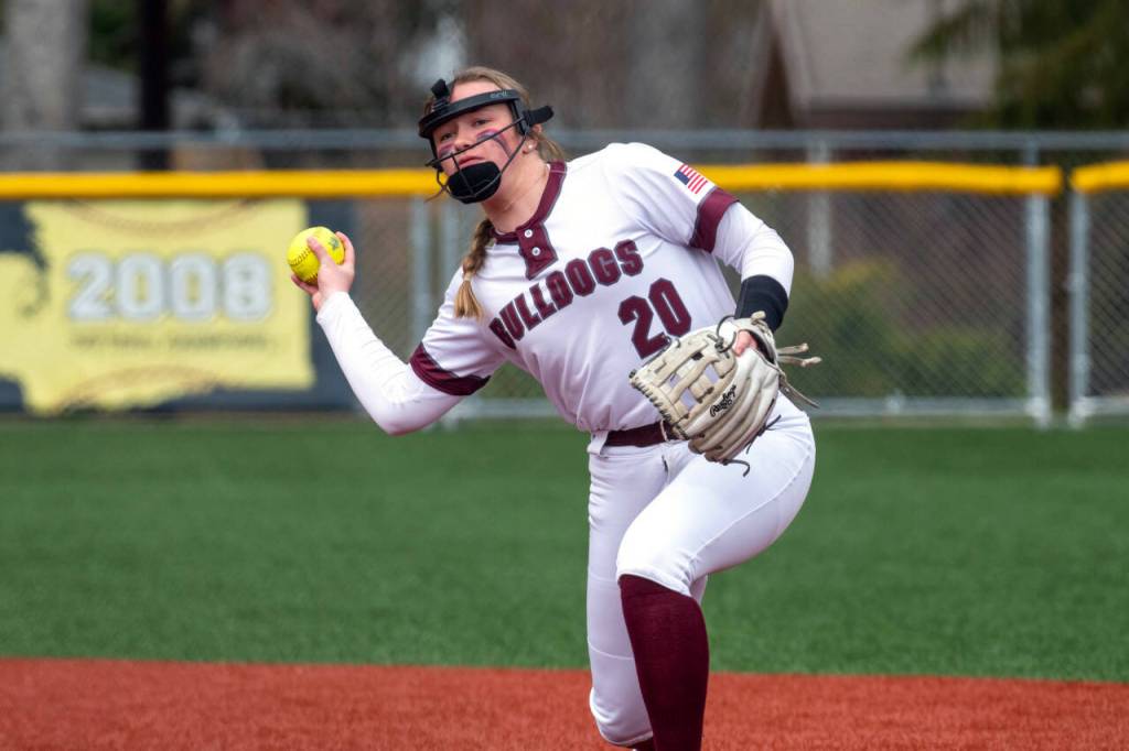 PHOTO BY FOREST WORGUM Montesanos Kaila Hatton throws to first during the Bulldogs 19-3 win over Nooksack Valley on Saturday in Montesano.