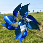 Photos by Matthew N. Wells / The Daily World
April is National Child Abuse Prevention Month. The Moore Wright Group staff wanted to make a striking visual statement, so they planted 1,200 pinwheels in their grass plot along Aberdeen Avenue to bring the violent issue to light.