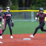 RYAN SPARKS / THE DAILY WORLD Montesanos Adda Potts, right, rounds second during the Bulldogs 16-0 victory over Tenino on Tuesday in Montesano.
