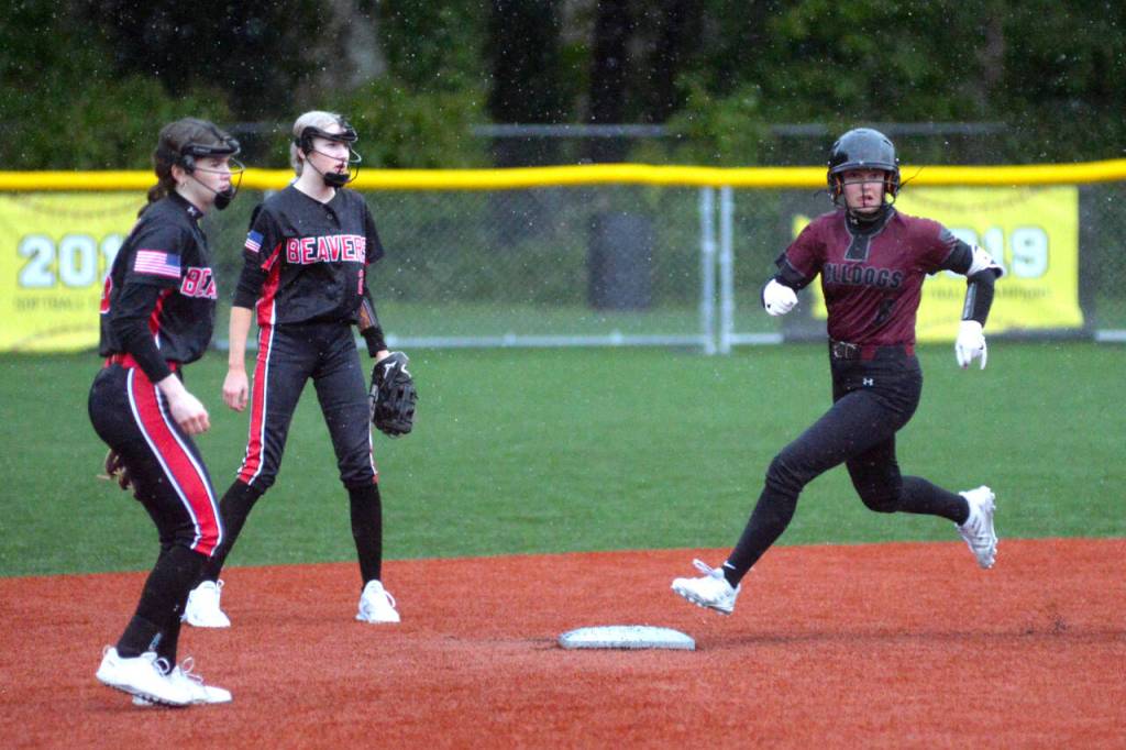 RYAN SPARKS / THE DAILY WORLD Montesanos Adda Potts, right, rounds second during the Bulldogs 16-0 victory over Tenino on Tuesday in Montesano.