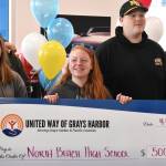 North Beach High Schools culinary arts students accept a $5,000 check on Wednesday afternoon from United Way of Grays Harbor for their hard work and dedication in making the 22nd Annual United Way of Grays Harbor Black & White Gala, which occurred in January, so successful. Aberdeen, Montesano and Lake Quinault high schools also received $5,000 checks from the nonprofit. And Tariq Woolen, Seattle Seahawks Pro Bowl cornerback, also donated brand new Nikes to each student.