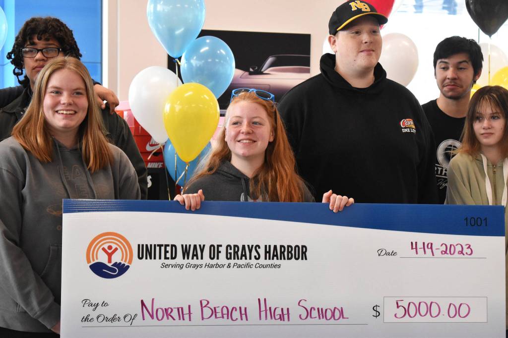 North Beach High Schools culinary arts students accept a $5,000 check on Wednesday afternoon from United Way of Grays Harbor for their hard work and dedication in making the 22nd Annual United Way of Grays Harbor Black & White Gala, which occurred in January, so successful. Aberdeen, Montesano and Lake Quinault high schools also received $5,000 checks from the nonprofit. And Tariq Woolen, Seattle Seahawks Pro Bowl cornerback, also donated brand new Nikes to each student.