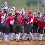 RYAN SPARKS | THE DAILY WORLD Hoquiams Ashlinn Cady (12) is greeted by her teammates after hitting a two-run home run in the bottom of the sixth inning during a 7-6 win over Montesano on Friday in Hoquiam.