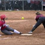 RYAN SPARKS | THE DAILY WORLD Hoquiams Ella Folkers, left, slides into third while Montesanos Alyssa Maldonado defends during the Grizzlies 7-6 win on Friday in Hoquiam.