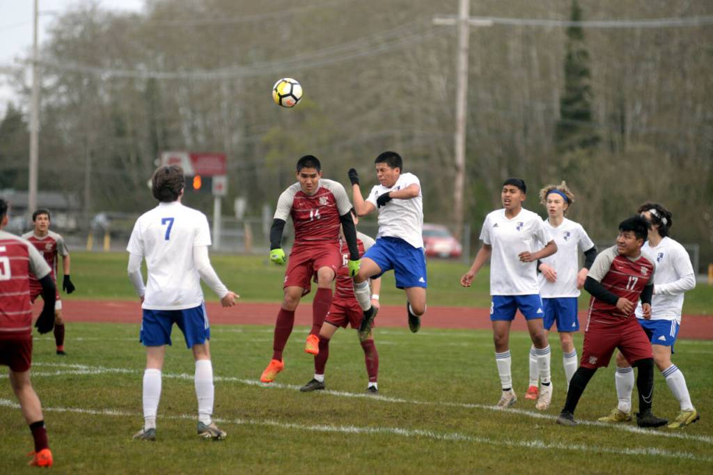 RYAN SPARKS | THE DAILY WORLD Hoquiams Kunanon Chaiyakam (14) and Elmas Hank Doelman compete for a header during the Eagles 3-2 on Friday at the Sea Breeze Oval in Hoquiam.
