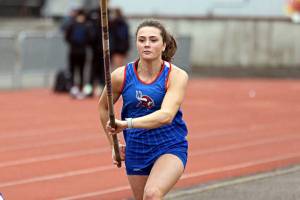 Willapa Valley's Lauryn McGough runs along the runway before a pole vault attempt at the Chehalis Activators Classic April 22 at W.F. West.