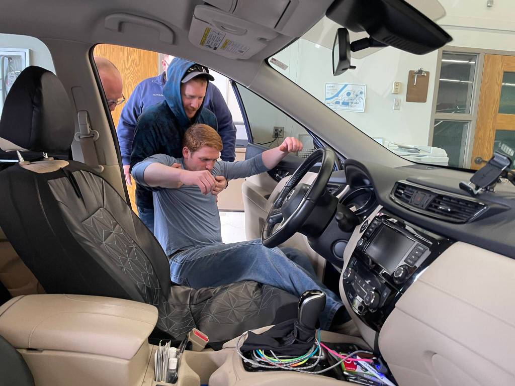 Volunteers removed Aaron Beach, a volunteer from Grays Harbor Fire District 2, from a simulated car crash.