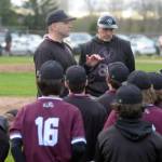 RYAN SPARKS | THE DAILY WORLD Montesanos Mike Osgood, left, talks to his team after collecting his 100th win as a head coach with an 11-5 win over Elma.